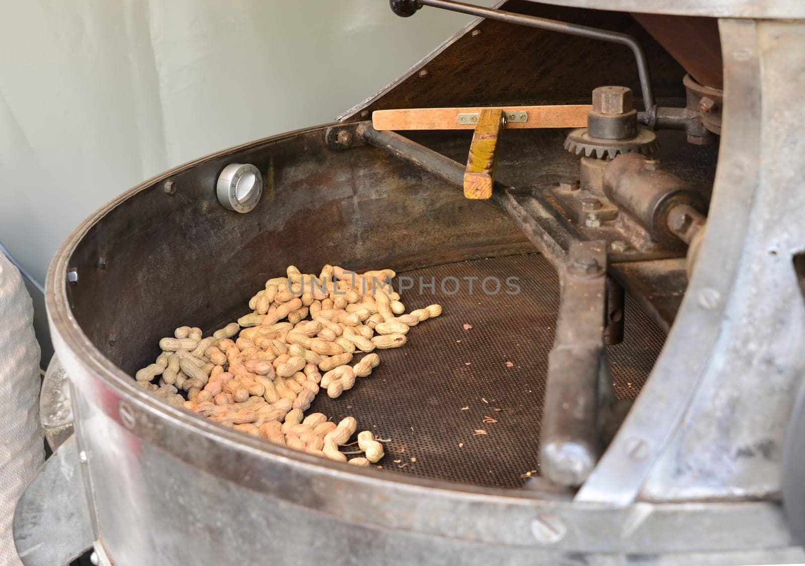 Roasted peanuts in an old machine-oven vintage