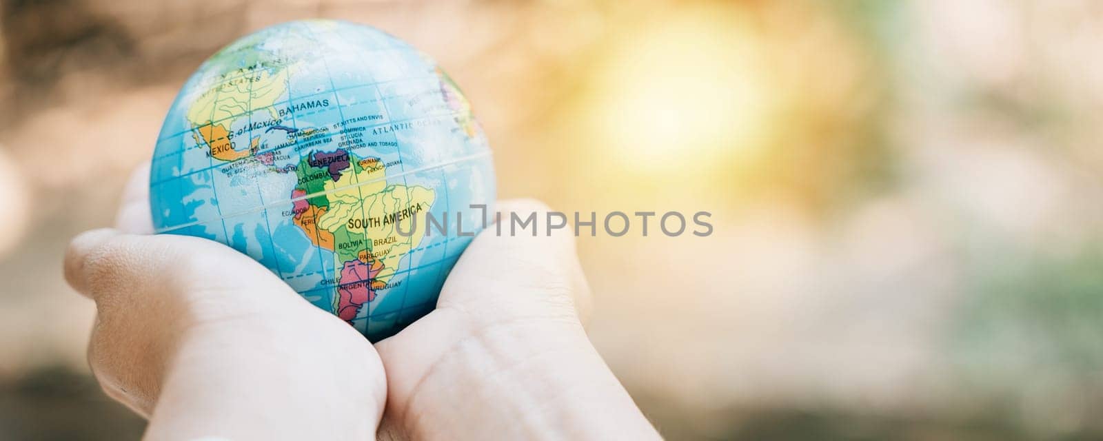 In honor of World Earth Day, embrace a green leaf and the globe, symbolizing Green Energy, ESG, and Environmental Care. Take on global responsibility for a sustainable and clean environment. by Sorapop