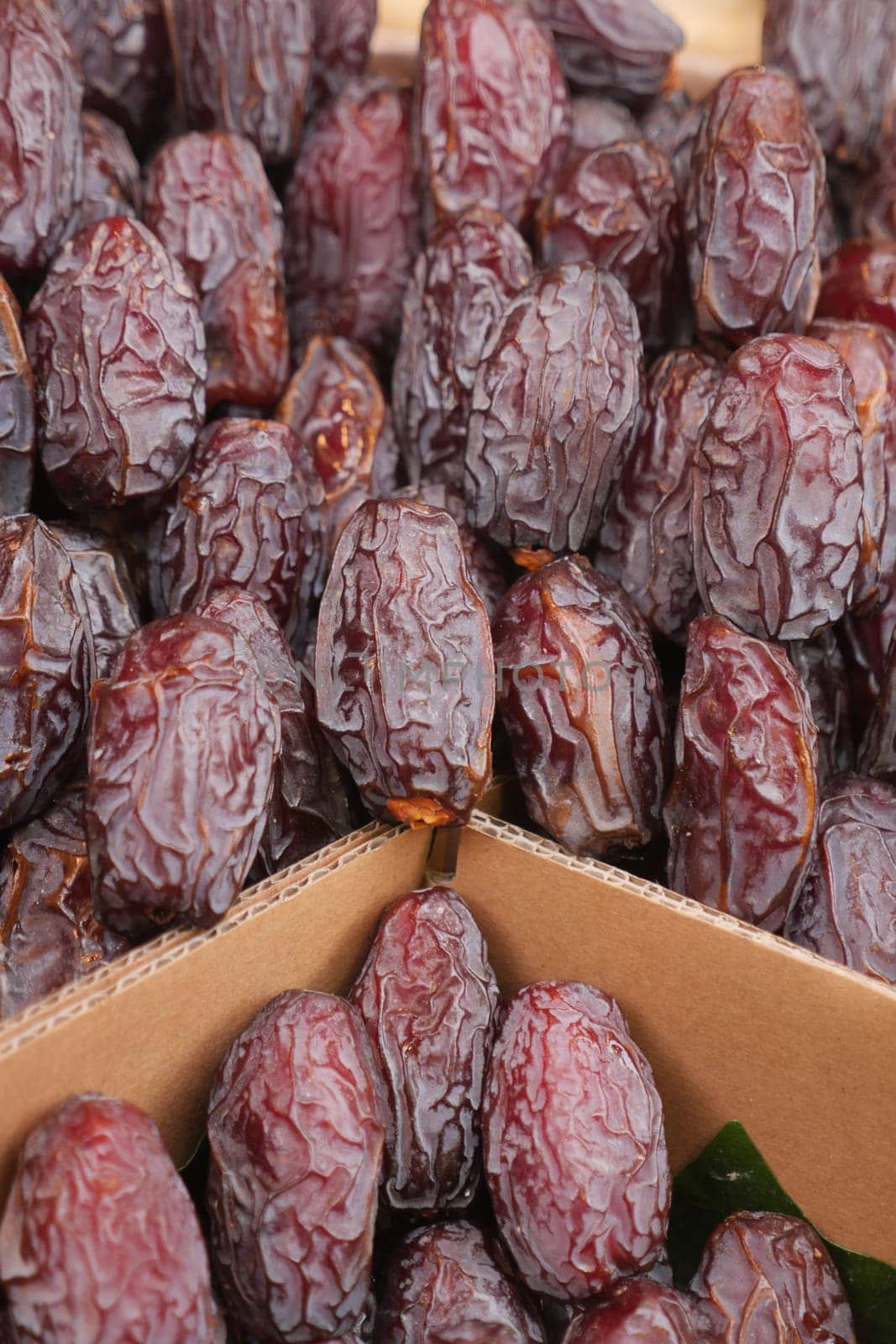 many date fruits display for sale at local market by towfiq007