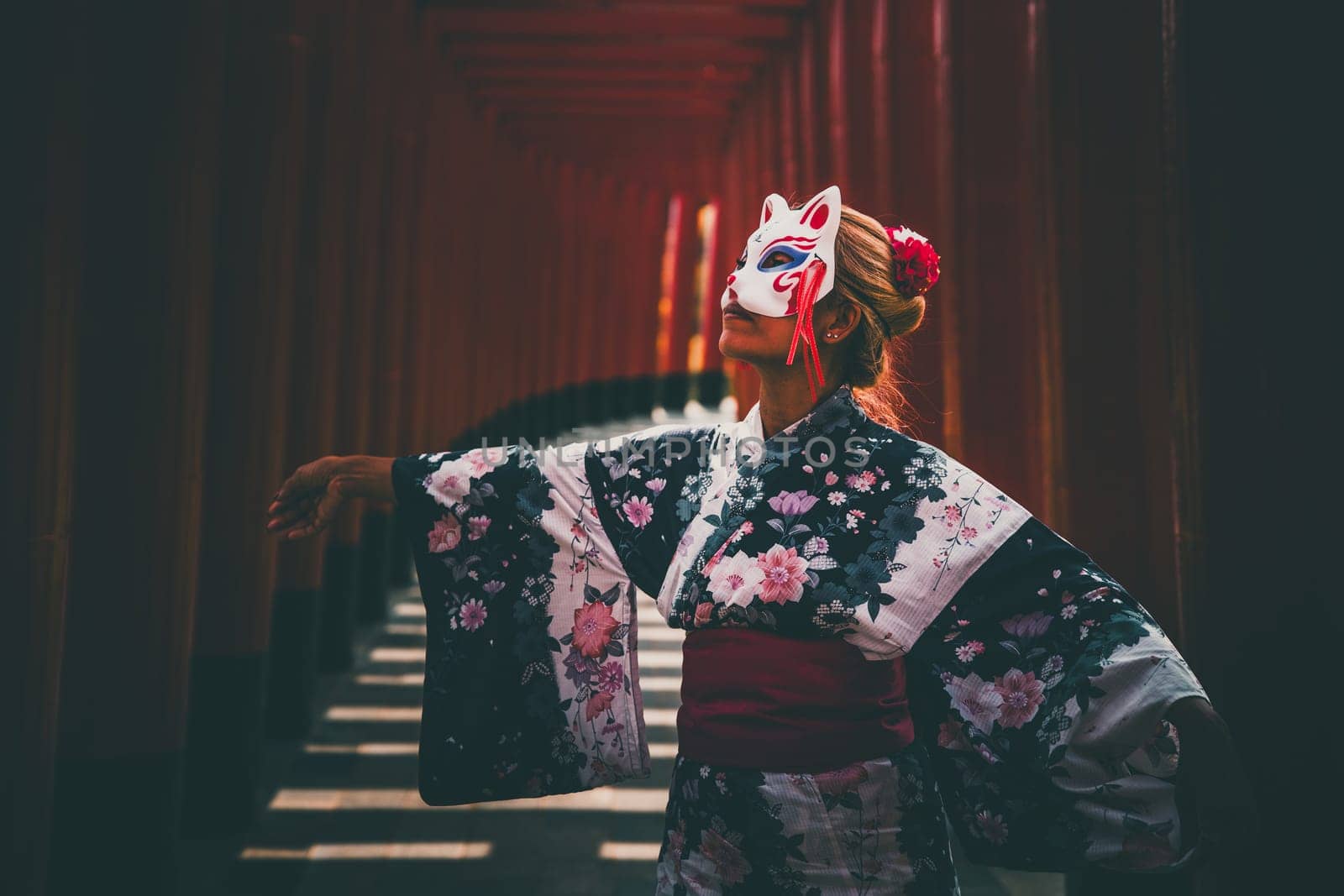 Asian girl in kimono and umbrella in Japanese theme park Hinoki Land in Chai Prakan District, Chiang Mai