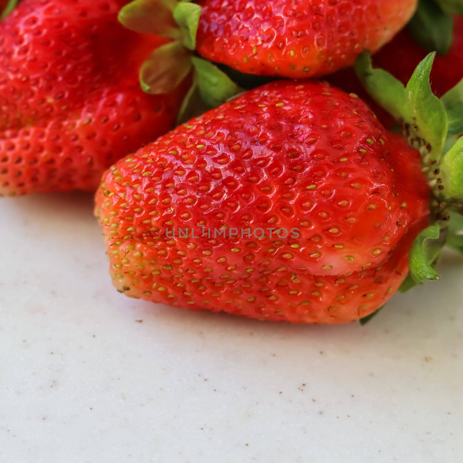 Large ripe red fresh juicy strawberries on a white background