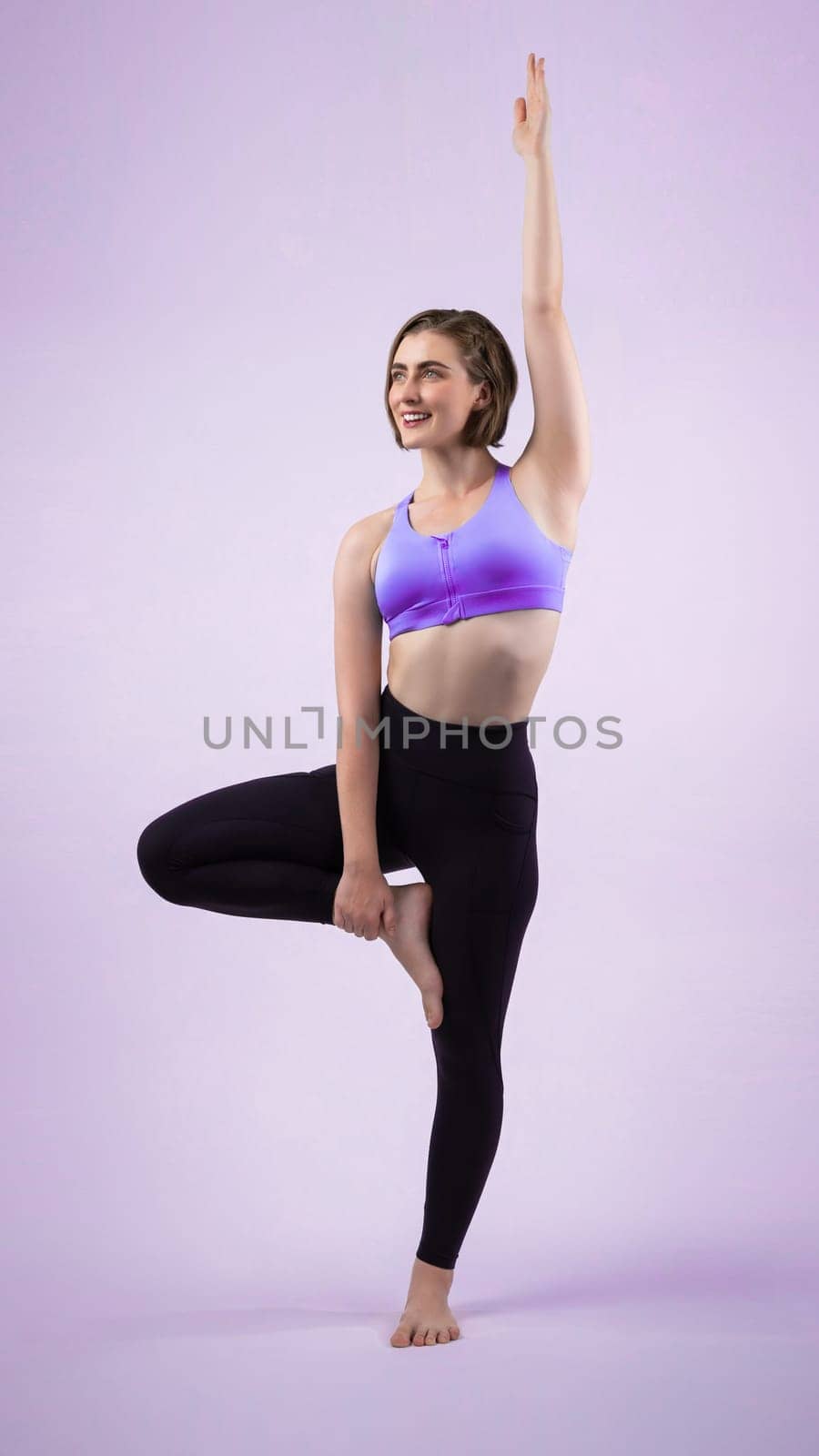 Full body length gaiety shot athletic and sporty woman doing healthy and meditative yoga exercise workout posture on isolated background. Healthy active and body care lifestyle