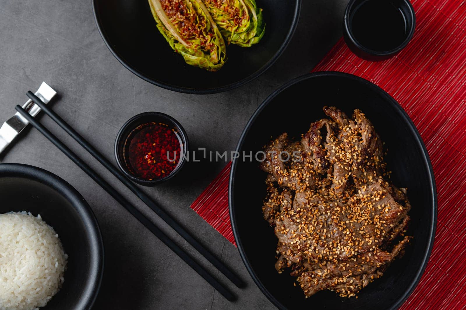 Beef bulgogi with vegetables, sauce and rice pilaf