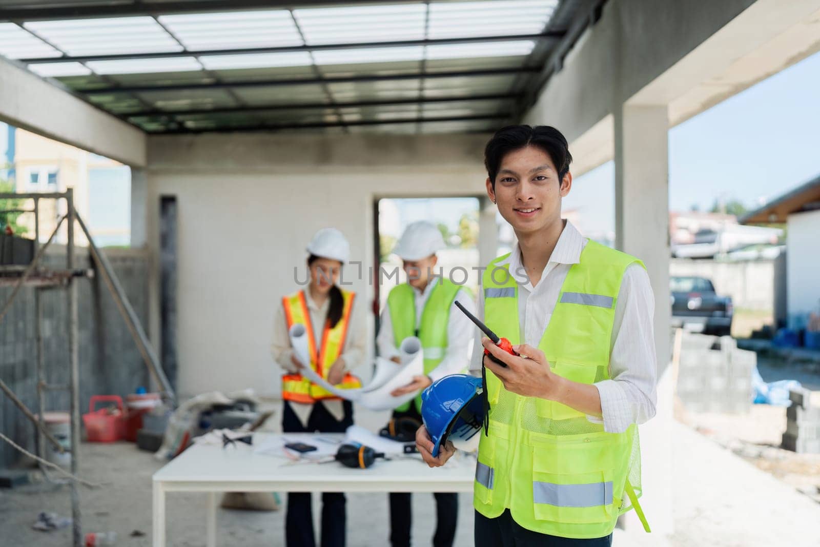 Portrait of Industry maintenance engineer man wearing uniform and safety hard hat on factory station by itchaznong