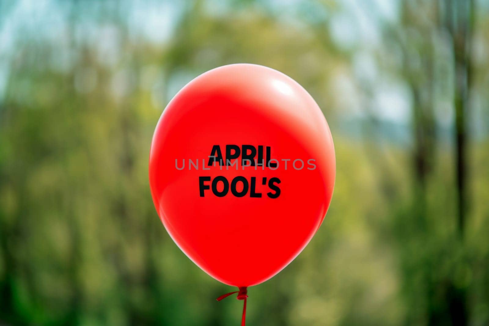 April Fool's Day. red balloon on background. AI generative.