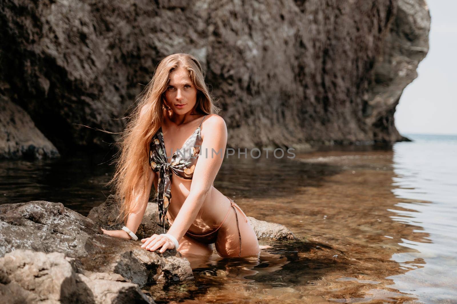 Woman travel sea. Happy tourist enjoy taking picture outdoors for memories. Woman traveler swim in the sea bay with mountains, sharing travel adventure journey by panophotograph