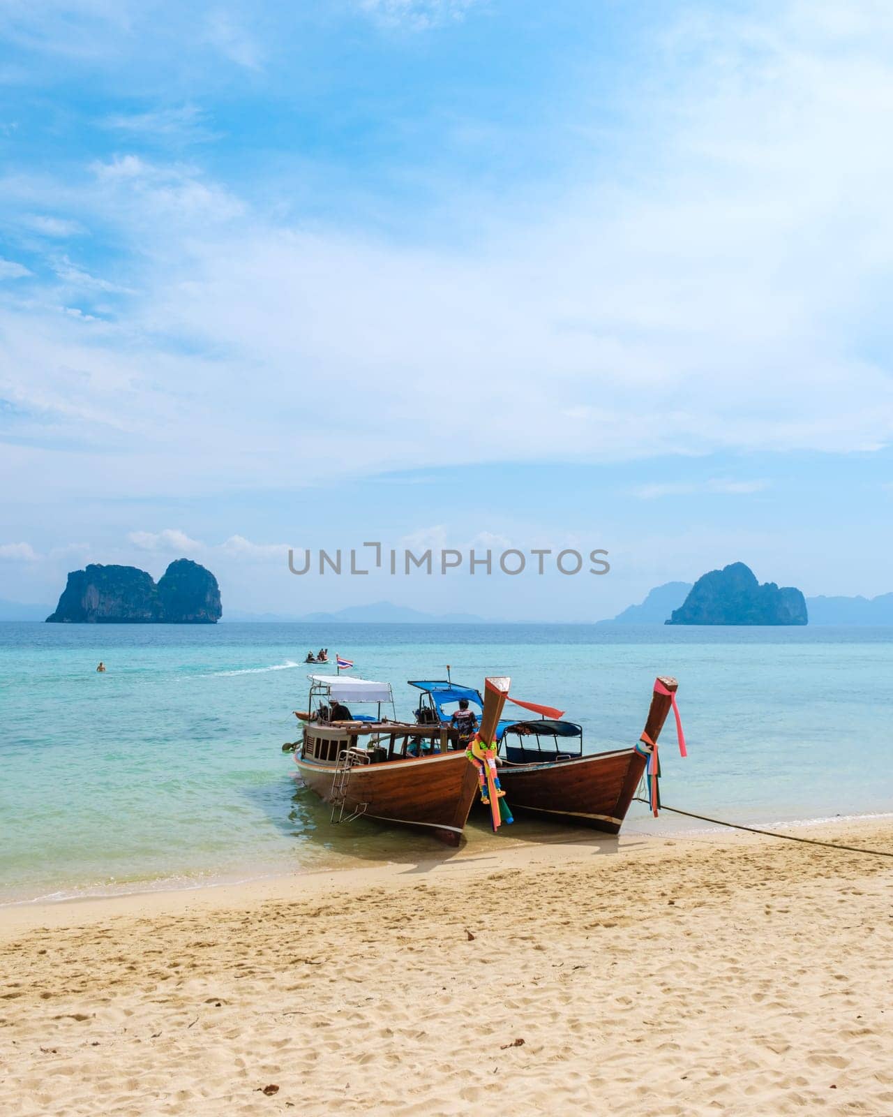 Longtail boats on the beach of Koh Ngai island tropical Island in the Andaman Sea Trang in Thailand by fokkebok