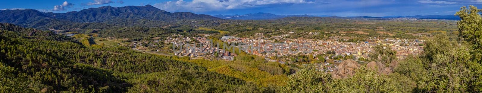 Panoramic picture small town Santa Coloma de Farners in Catalonia of Spain by Digoarpi
