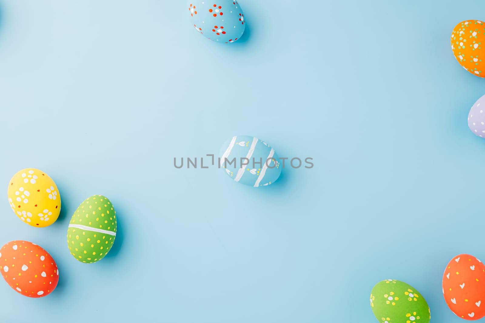 Overhead easter eggs isolated on blue background by Sorapop