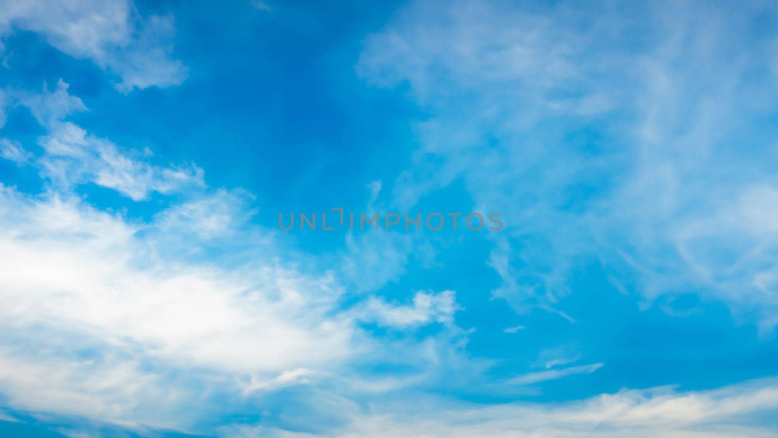 Serene Sky Canvas - Summer Blue with Gentle Clouds