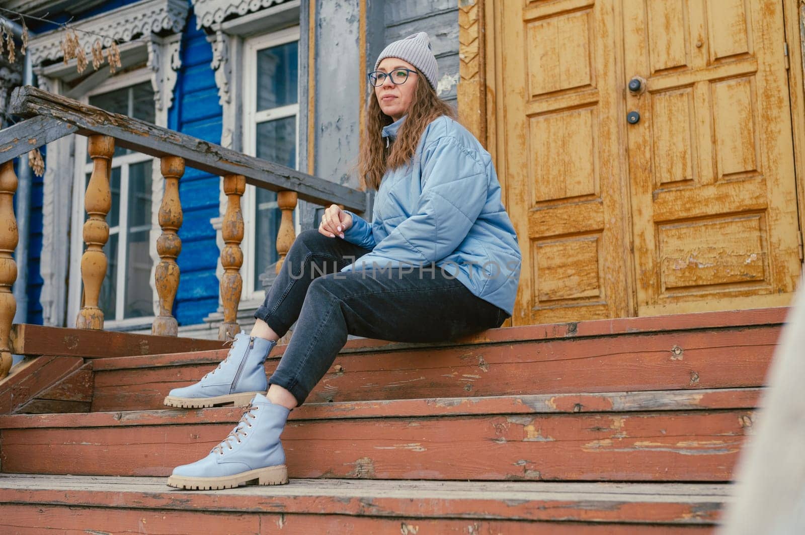 Portrait of a stylish woman in blue jacket. Spring outdoor portrait.