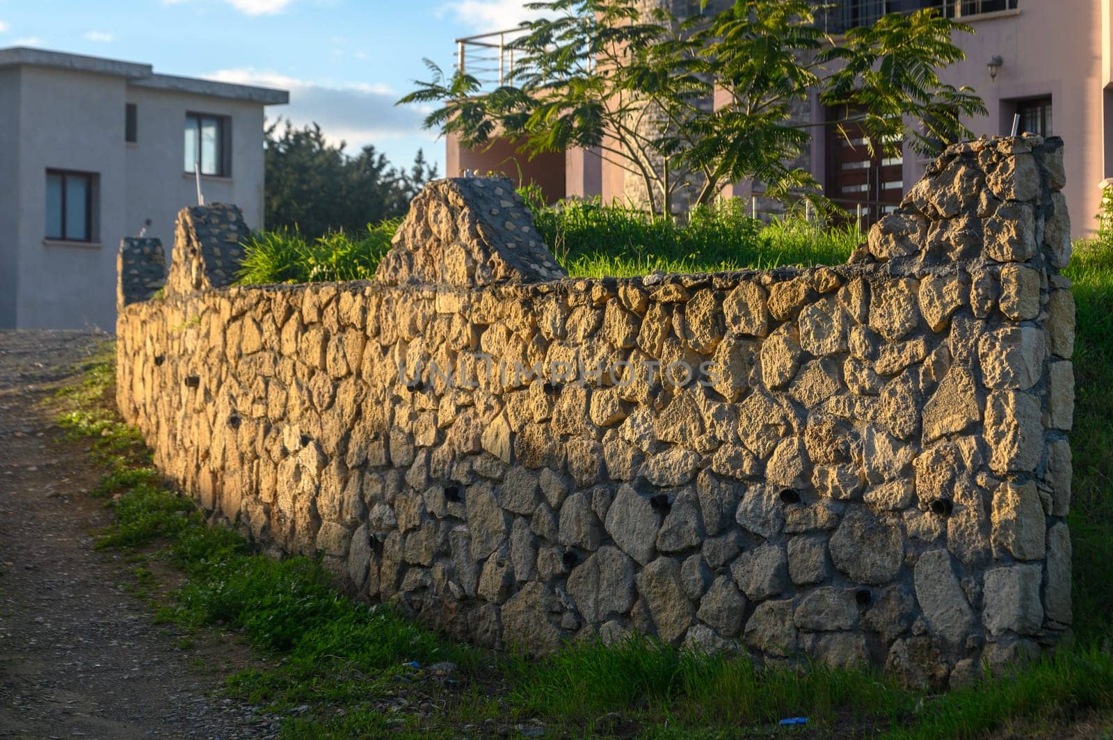 fence made of real stone in the village