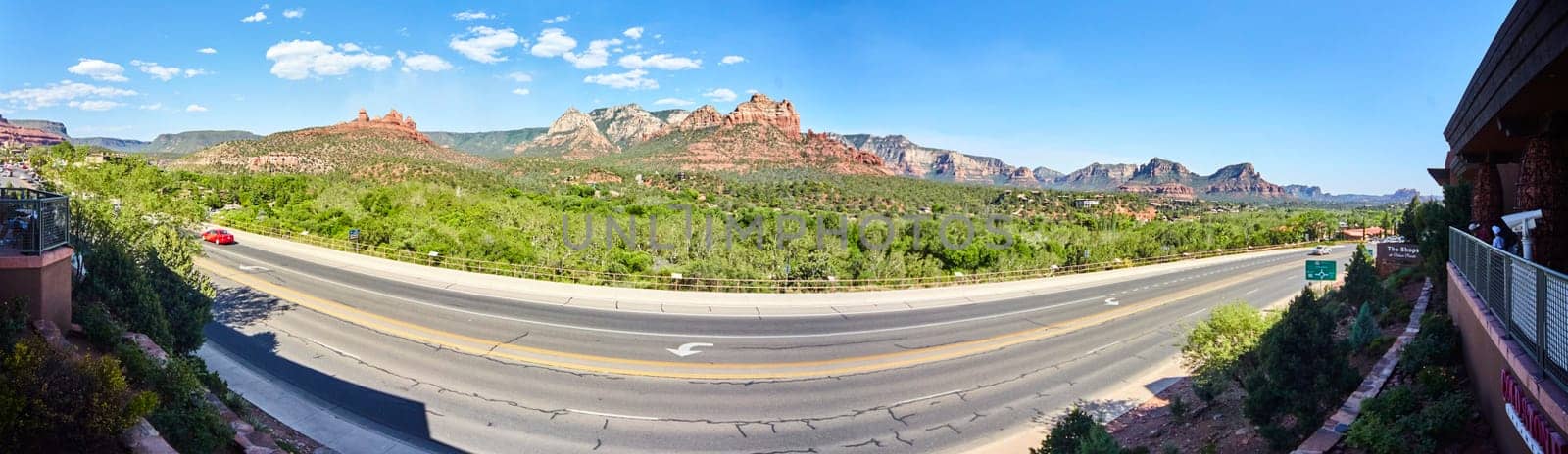Sedona Panorama: Serene Highway View with Red Rock Formations and Blue Sky in Arizona, 2016