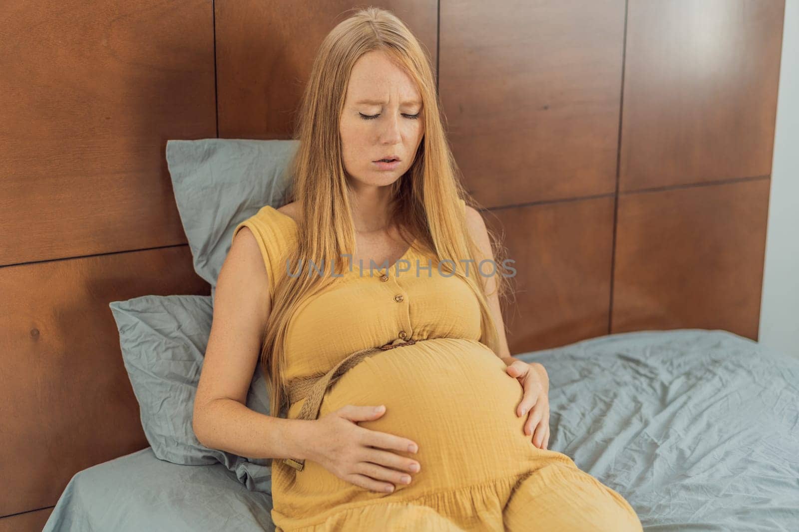 Expectant woman experiences discomfort, feeling unwell during pregnancy by galitskaya