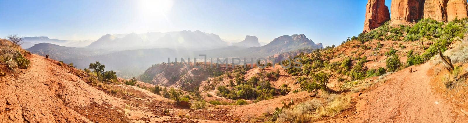 Golden hour panorama of Arizona's rugged desert landscape featuring Sedona's red sandstone formations, 2016