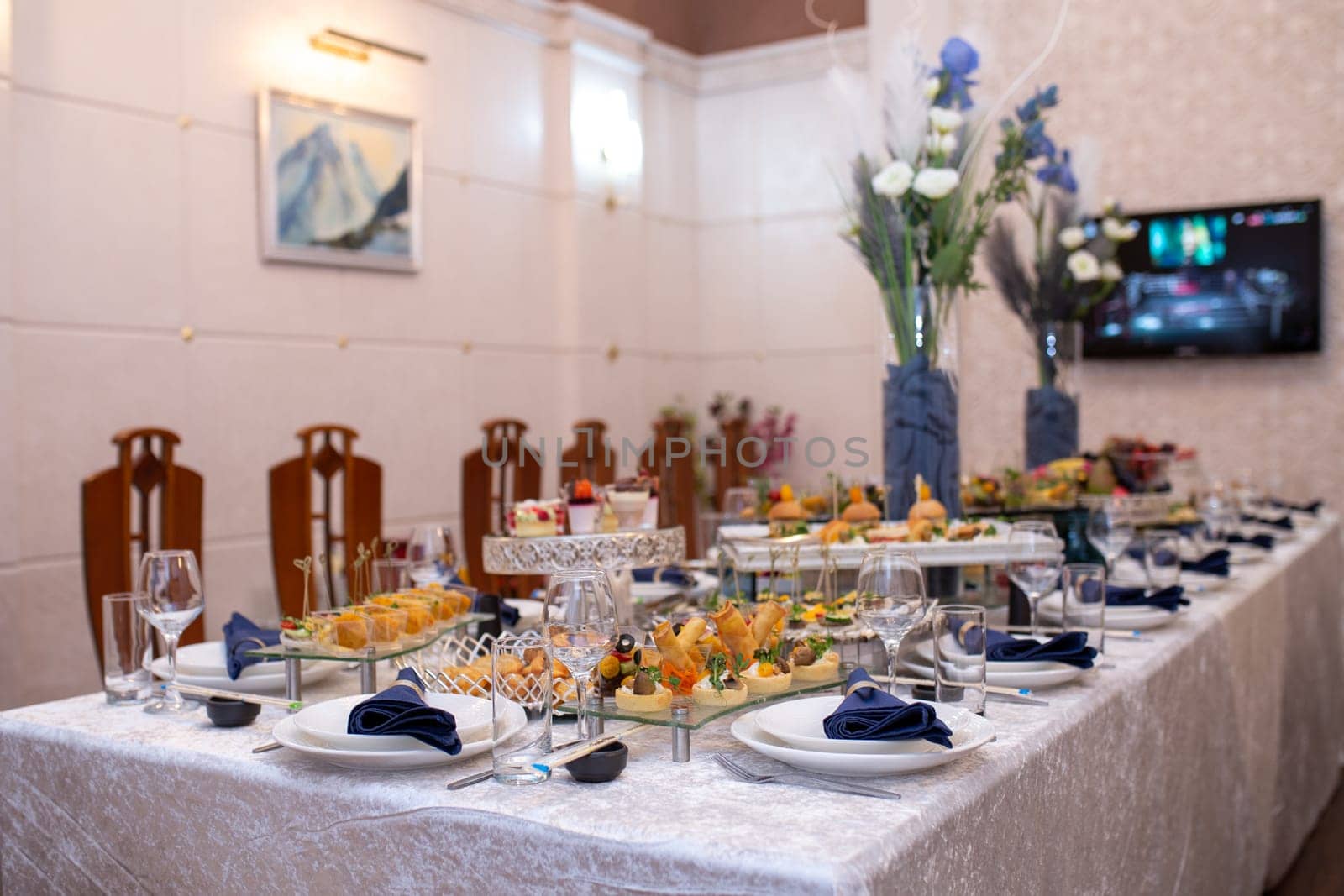 Exquisite Table Setting with Gourmet Dishes, Refreshing Drinks, and Elegant Decor by Pukhovskiy