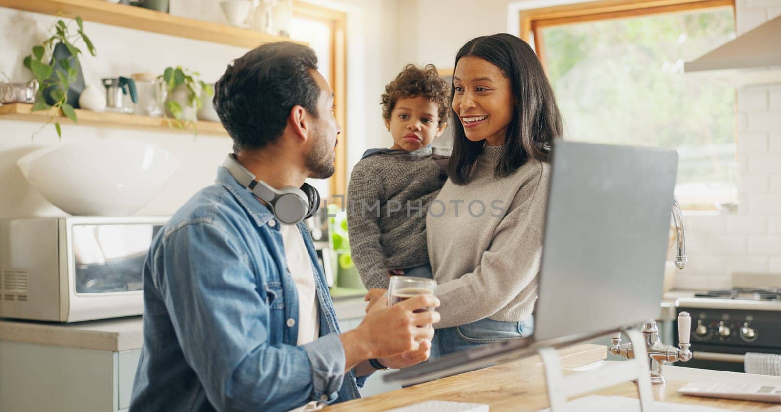 Kitchen, speaking and parents with a laptop, child and communication with internet connection, funny and chatting. Network, mother and father with technology, male child and conversation with humor.
