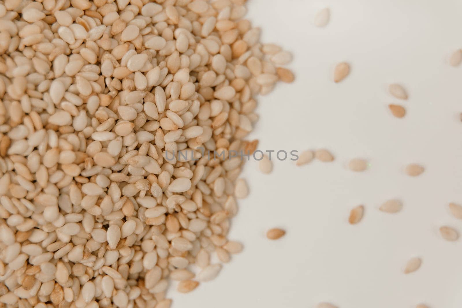 sesame seeds. Pile of white sesame seeds as background, top view by Matiunina