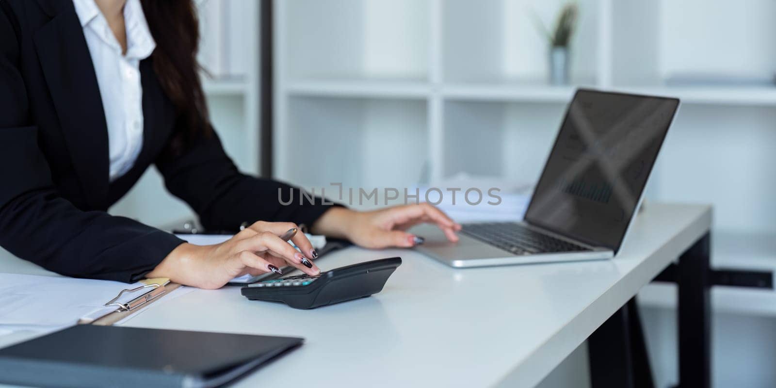 Businesswoman working with document on desk, accountant checking company budget accounting documents.