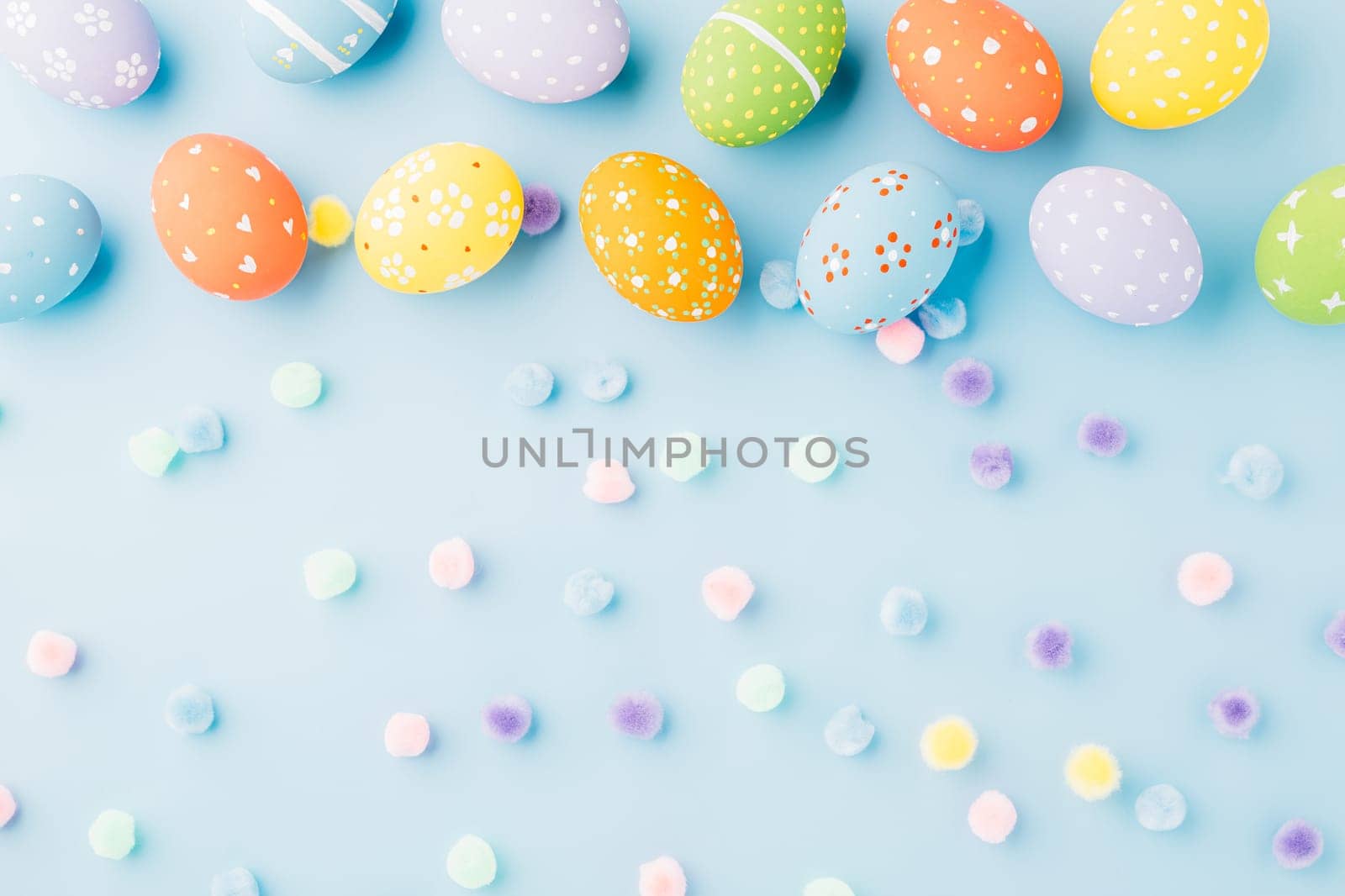 Colorful easter eggs isolated on blue background by Sorapop