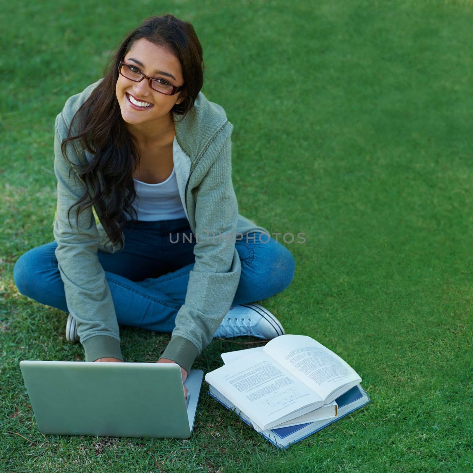 Woman, garden and laptop with notebook, glasses and computer for study, learning and college. Latino student, garden and technology for research, communication and university for online education by YuriArcurs