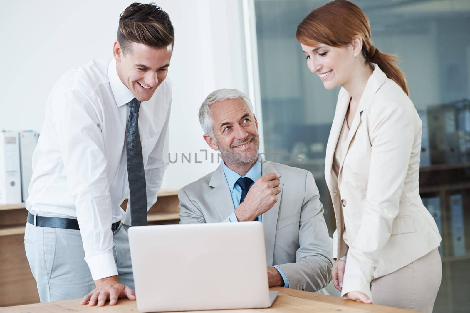 Business people, laptop and training for support in boardroom, communication and meeting in office. Senior manager, employees and technology for assistance in planning, mentor and advice for work by YuriArcurs