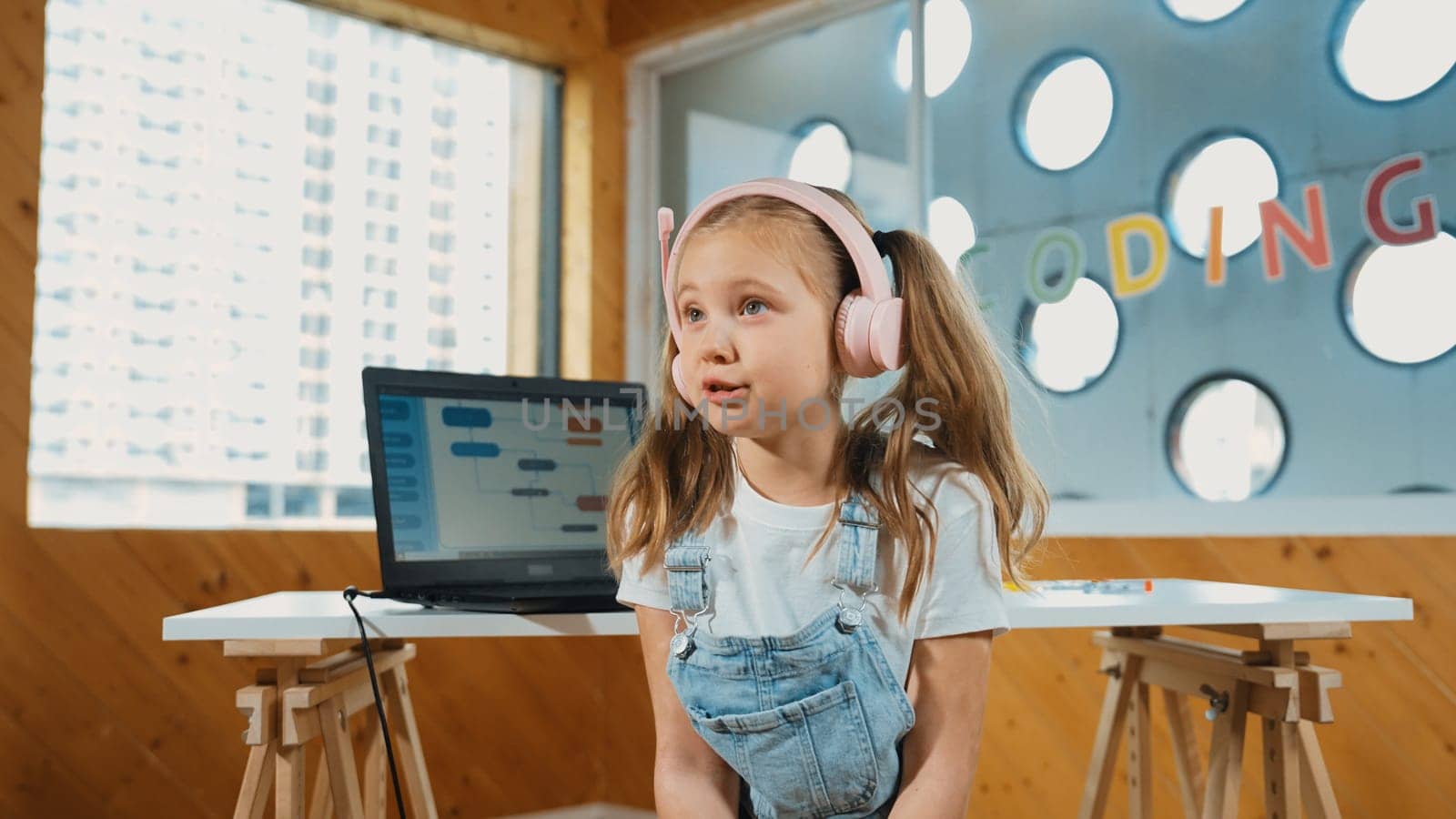 Caucasian tired girl bored while laptop screen display engineering prompt programing code. Pretty smart student with headphone asking or talking about science technology in STEM education. Erudition.