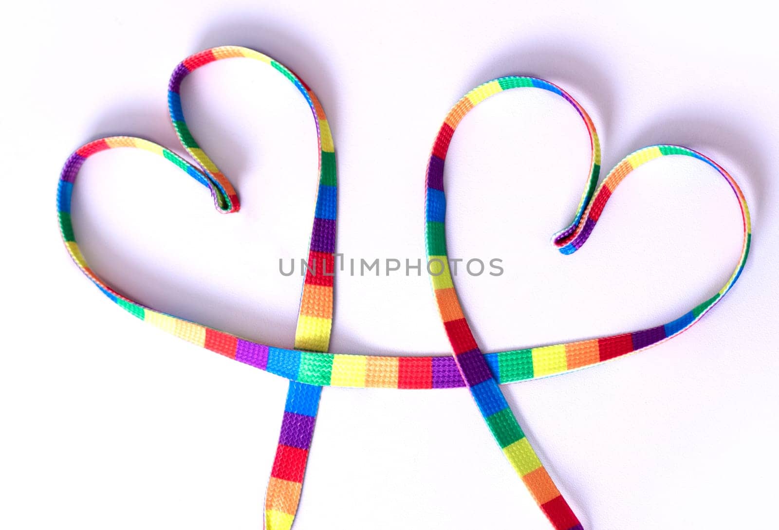 two hearts in rainbow colors on a white background. by Suietska