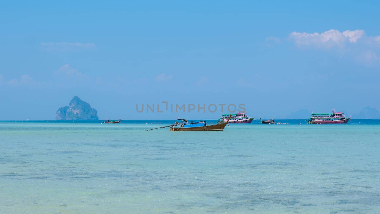 Koh Kradan is a tropical island with palm trees soft white sand, and a turqouse colored ocean in Koh Kradan Trang Thailand