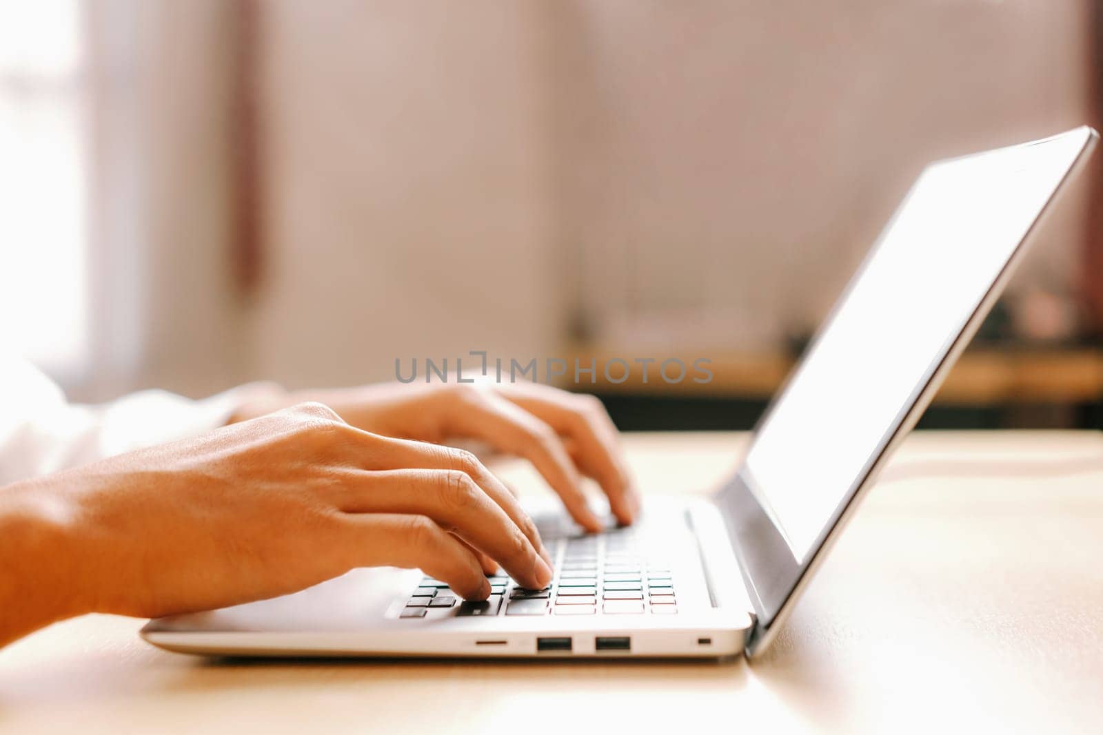 Businessman hand using laptop computer in office. uds by biancoblue