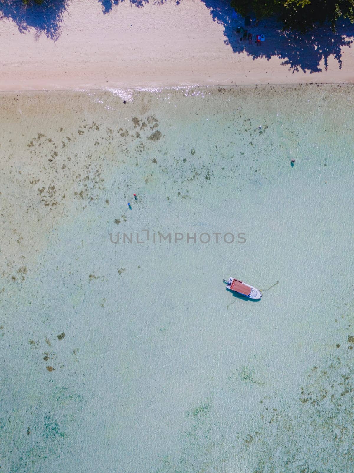 aerial view at Koh Kradan a tropical island with a coral reef ,soft white sand, and a turqouse colored ocean in Koh Kradan Trang Thailand