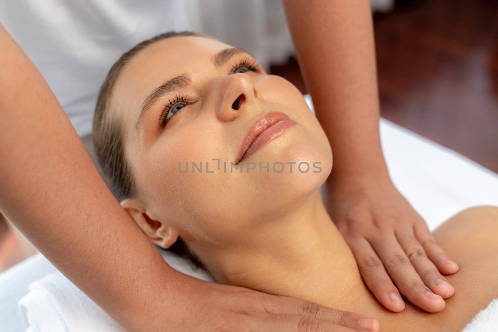 Caucasian woman customer enjoying relaxing anti-stress massage. Quiescent by biancoblue