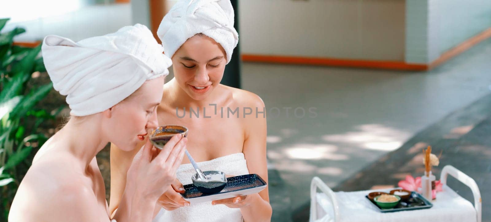 Couple of beautiful girls interested in homemade facial mask.Tranquility. by biancoblue