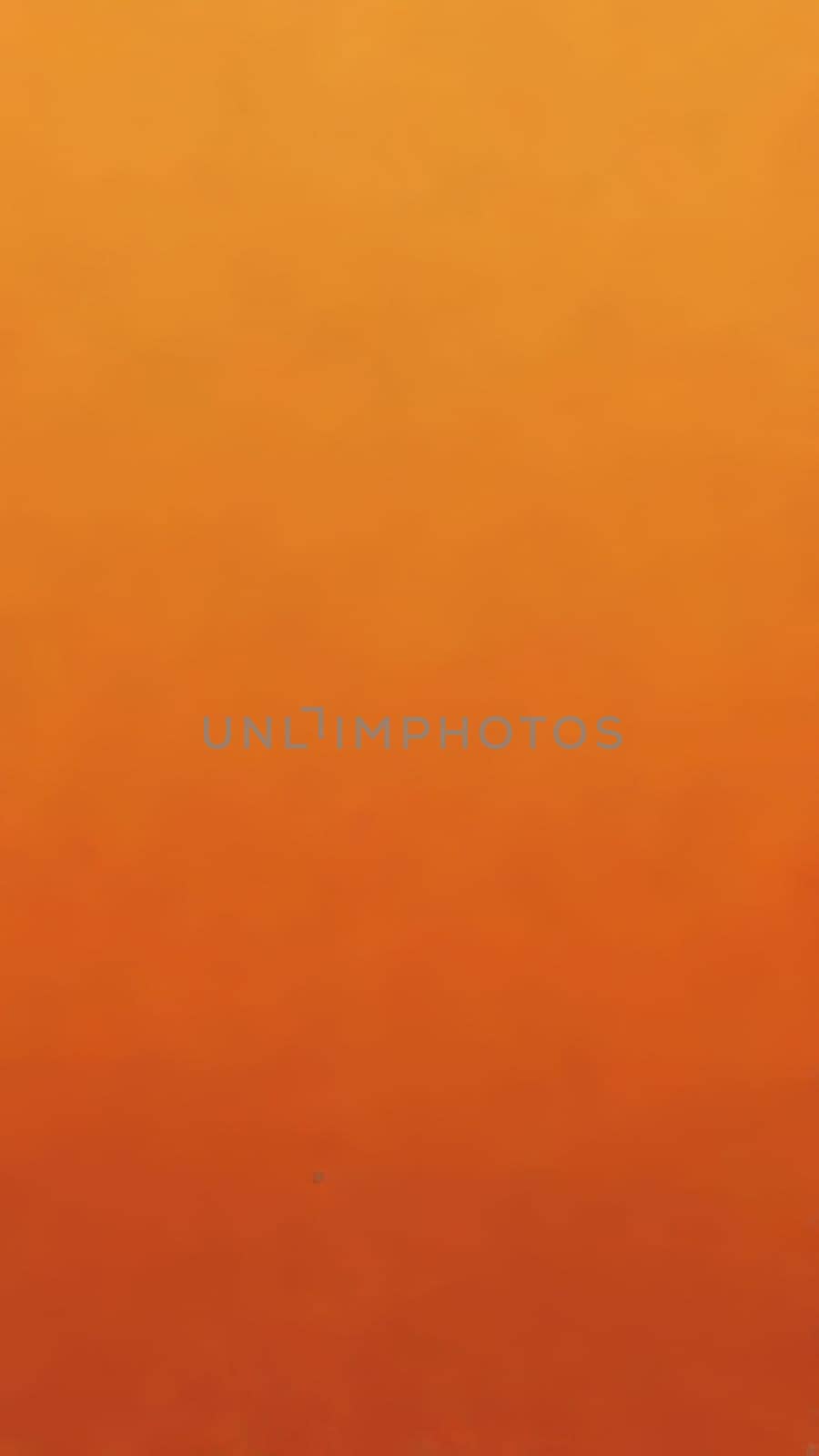 A gradient wallpaper with Stippled shapes using orange and bisque gradient colors. Generative AI.