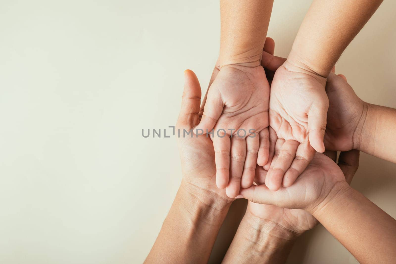 Parents and kid hold empty hands top view isolated. Commemorating Family Day expressing togetherness support and lineage.