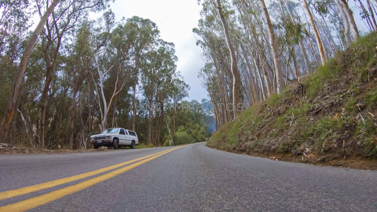 Santa Maria, California, USA-December 6, 2022-In this serene winter scene, a vehicle carefully makes its way along Los Osos Valley Road and Pecho Valley Road within Montana de Oro State Park.