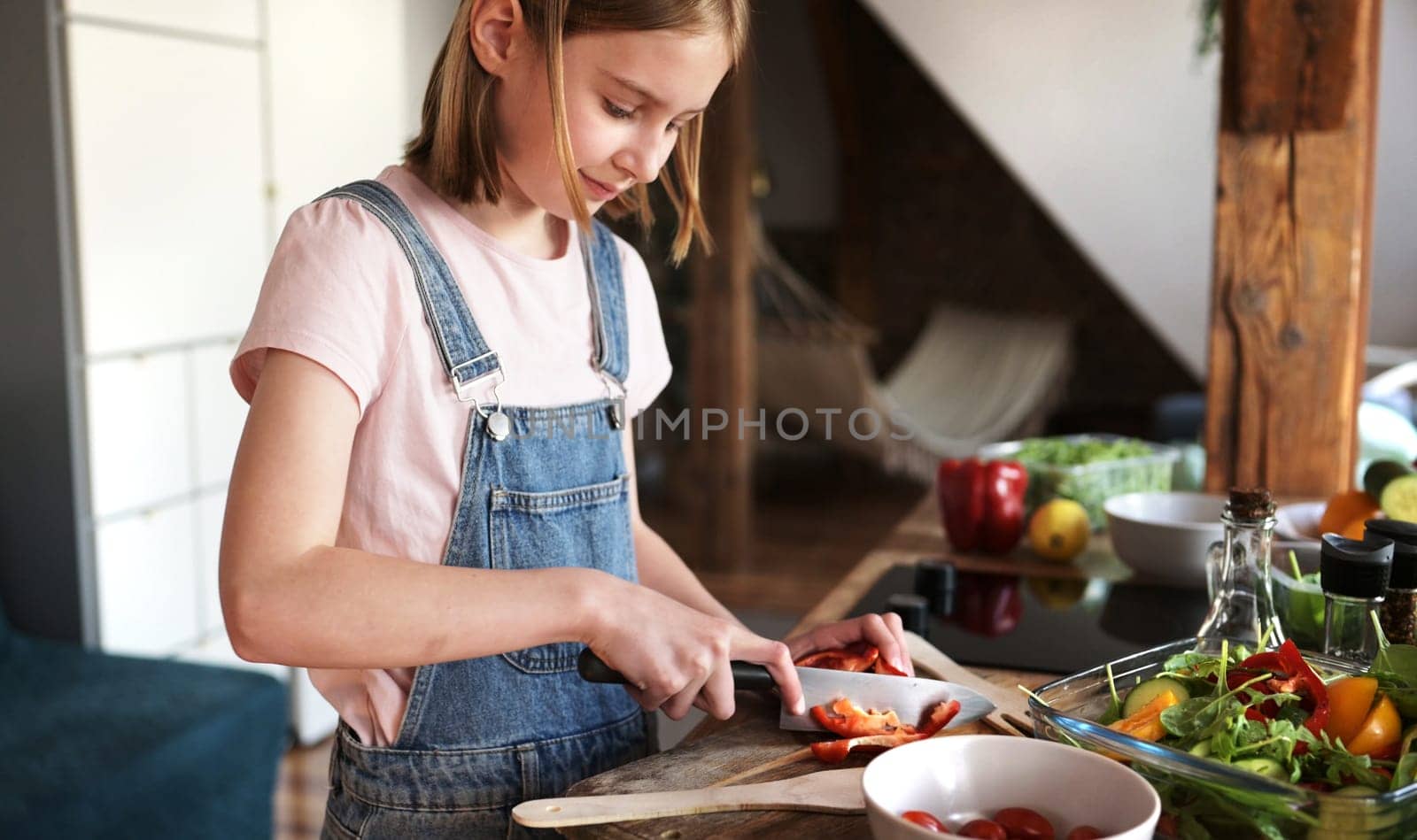 Cute Little Girl Cooking A Vegetable Salad In The Kitchen by GekaSkr