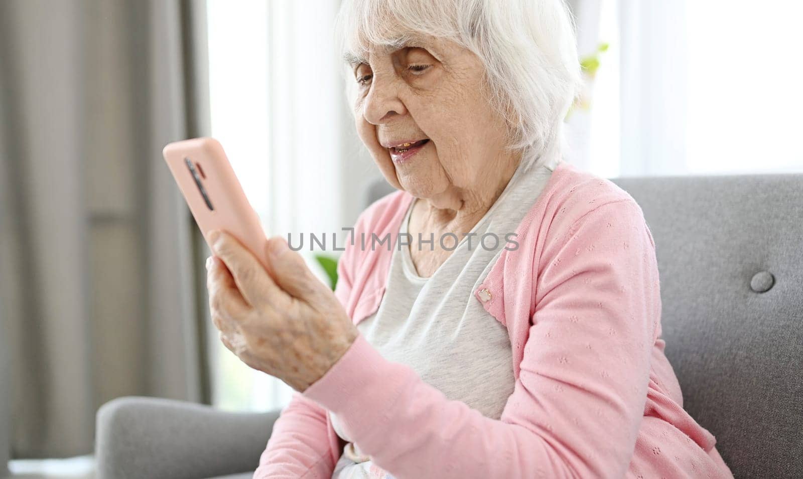Old Woman Is Video Calling Using Smartphone by GekaSkr