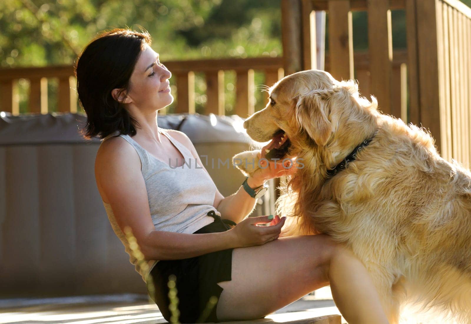 Girl Sitting Near House Petting Golden Retriever Dog, Taking Paw