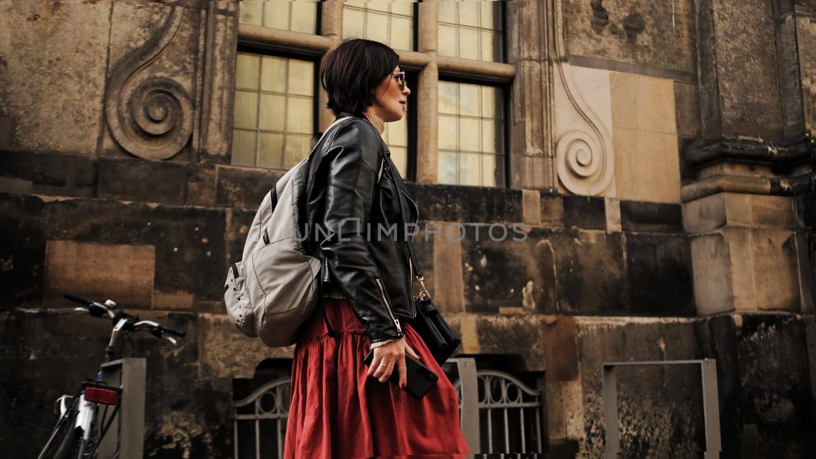 Stylish Woman Strolls Through Dresden Historic Tourist Streets by GekaSkr