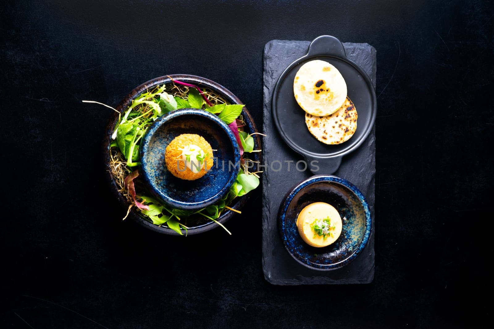 Closeup of some spanish croquettes in bed of lettuce served as tapas