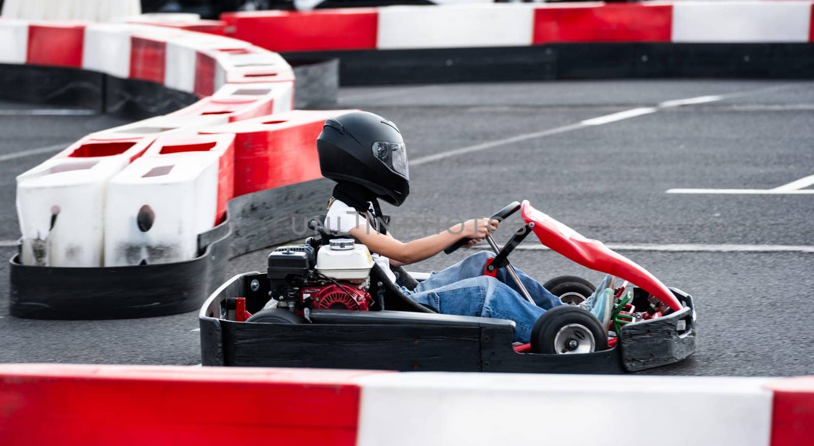 Little Girl Rides Go-Kart On Race Track by GekaSkr