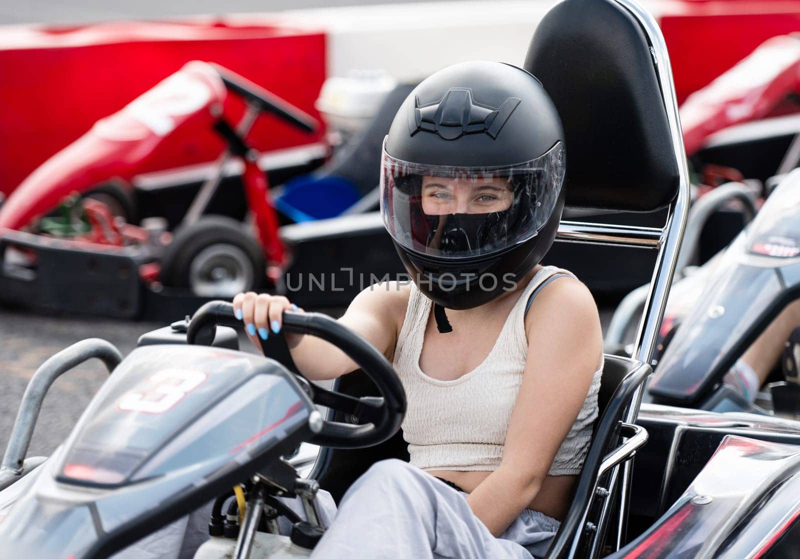 Portrait Of Young Girl In Protective Helmet In Racing Karting by GekaSkr