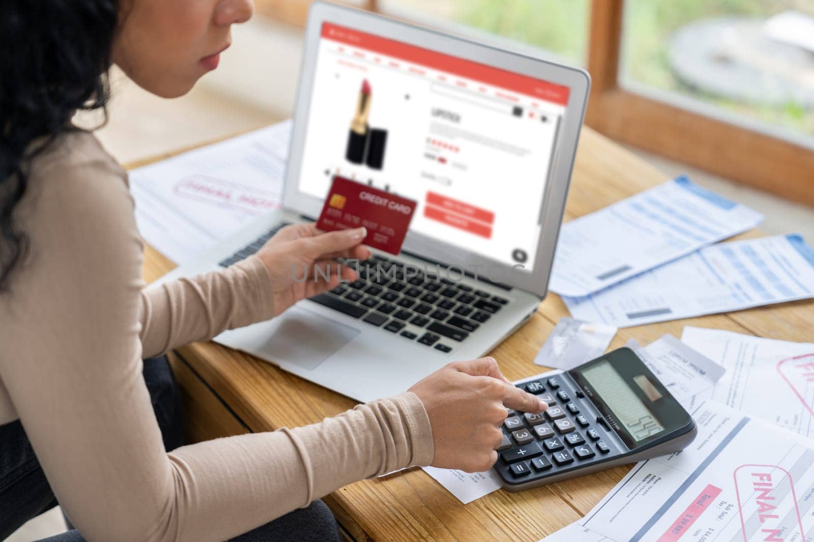 Woman shopping online on internet marketplace browsing for sale items for modern lifestyle and use credit card for online payment from wallet protected by crucial cyber security software