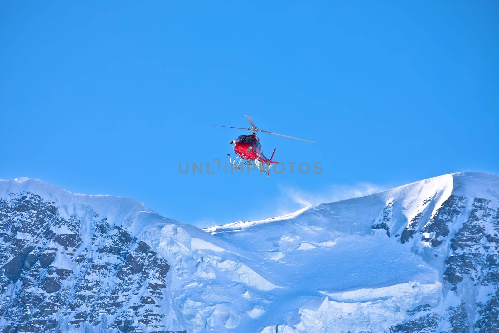 Helicopter flying in Matterhorn Glacier Paradise alpine area, village of Zermatt, Switzerland