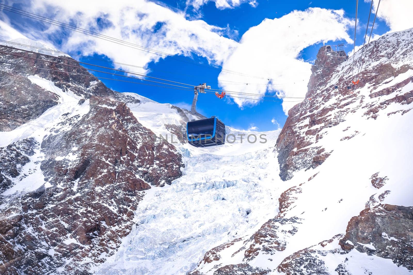 Matterhorn Glacier Paradise gondola and Theodul Glacier in Zermatt view by xbrchx