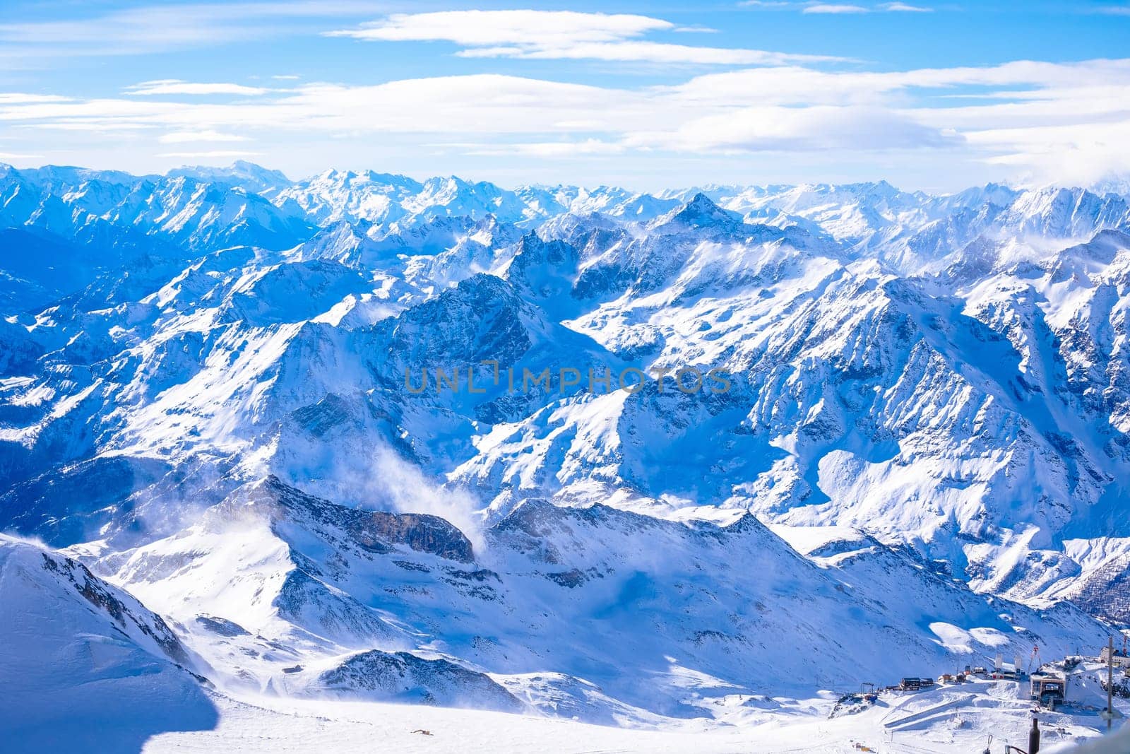 Snowy Alps peaks view from Little Matterhorn peak, border of Italy and Switzerland