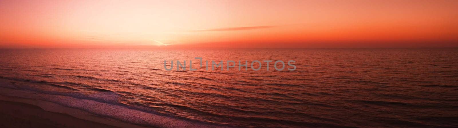 Aerial view of beach at sunset by homydesign