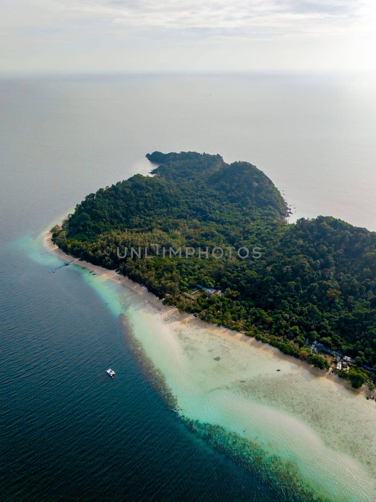 Drone top aerial view at Koh Kradan a tropical island with a turqouse colored ocean in Koh Kradan Trang Thailand