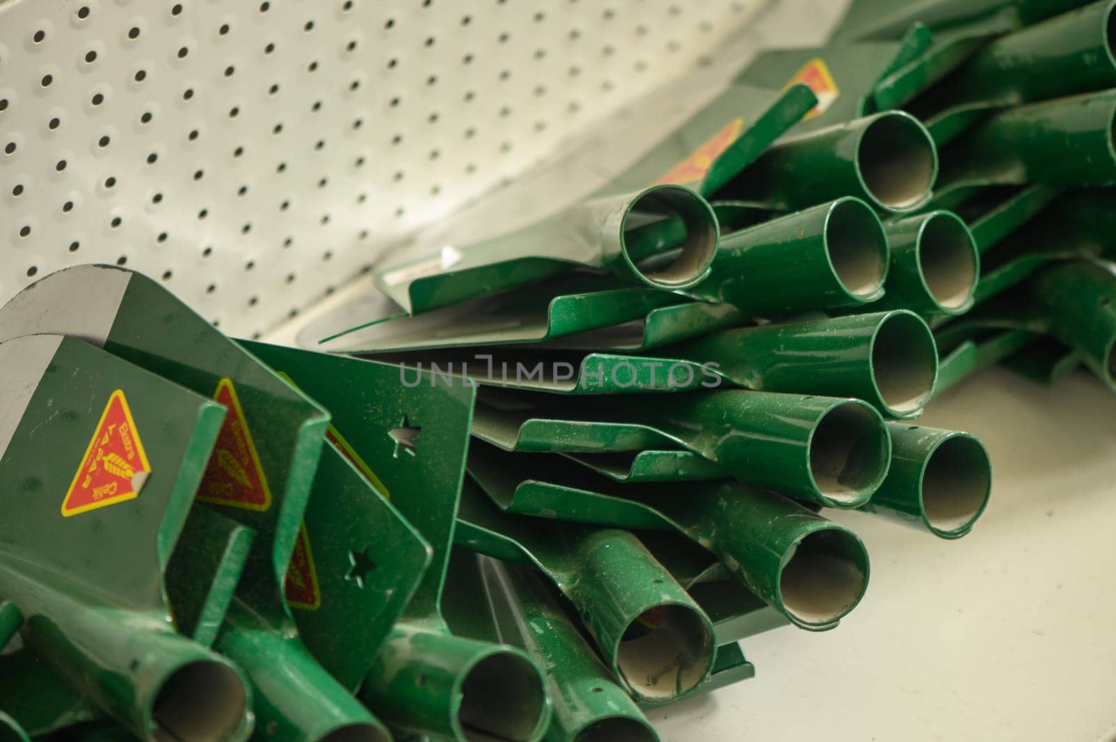 shovels on a shelf in a store